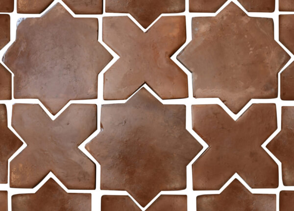 star cross brown terracotta tile pattern