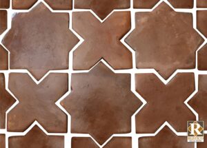 star cross tile pattern in brown terracotta flooring