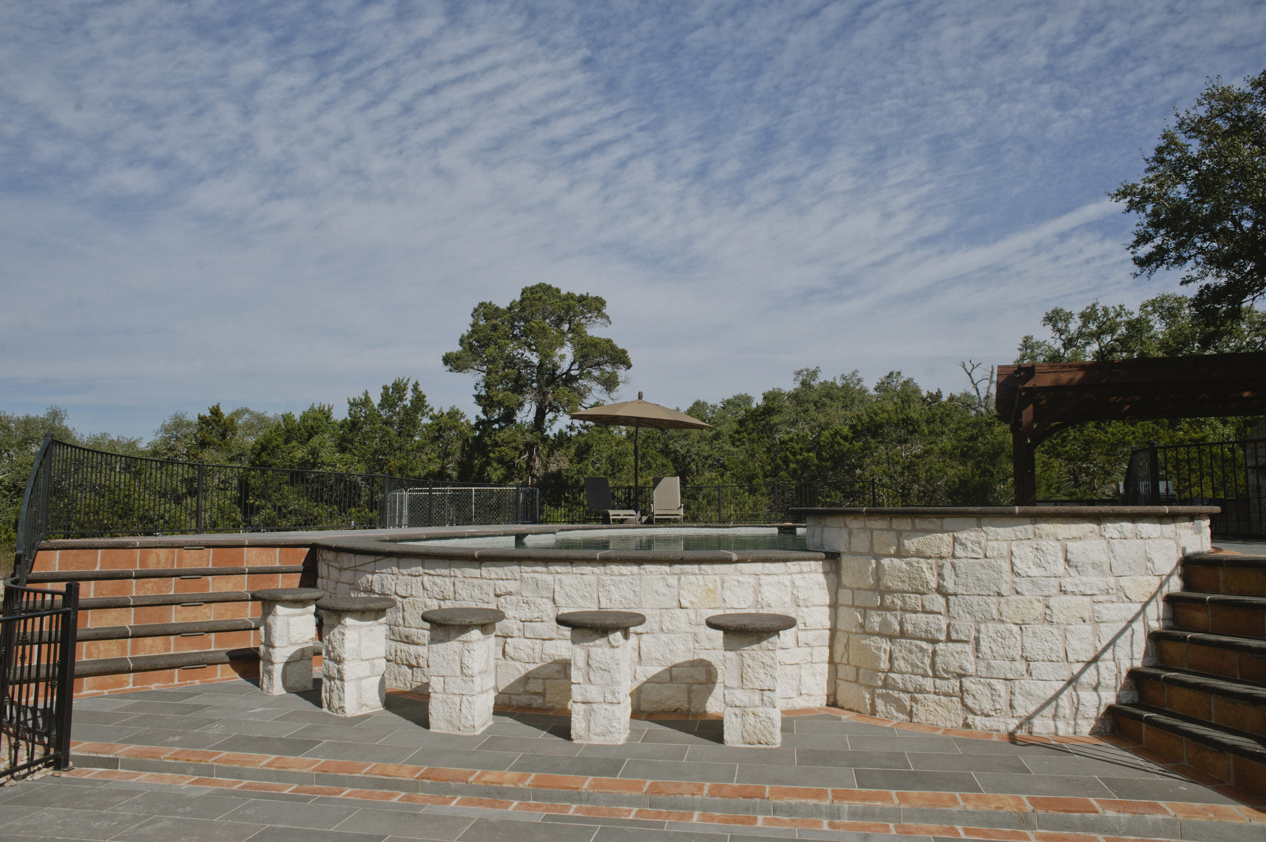 outdoor patio with cantera stone tile and terracotta pavers