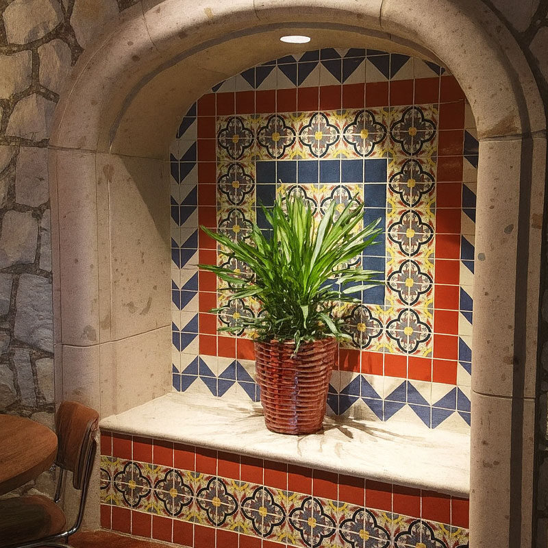 cantera stone niche with talavera tile backsplash